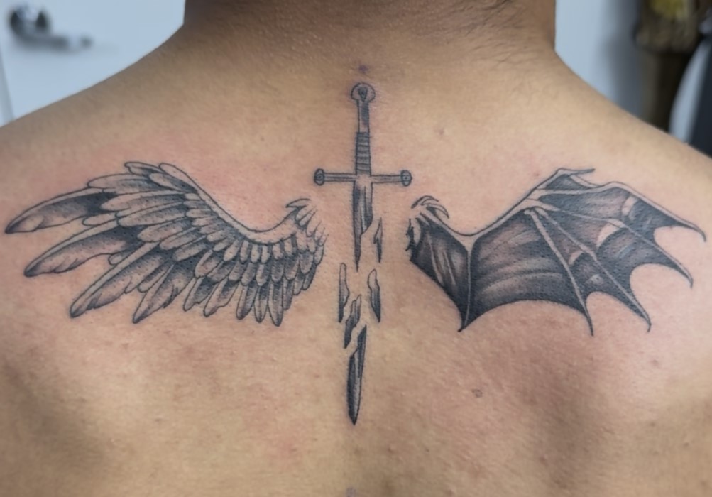 Custom tattoo artists Surrey – artist sketching unique tattoo design for client