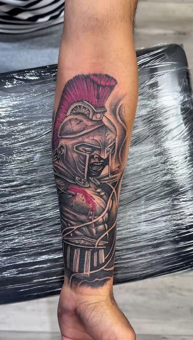 Best tattoo shop for custom tattoos Surrey – client showing new custom design